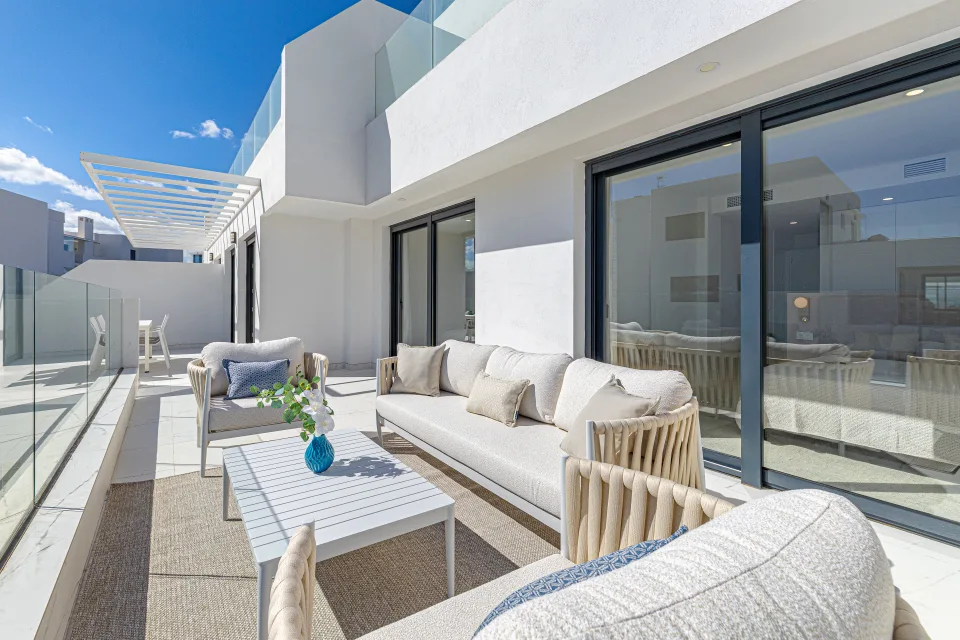 Vacation rental photograph of a bright terrace with modern furniture and clear views in Casares Costa