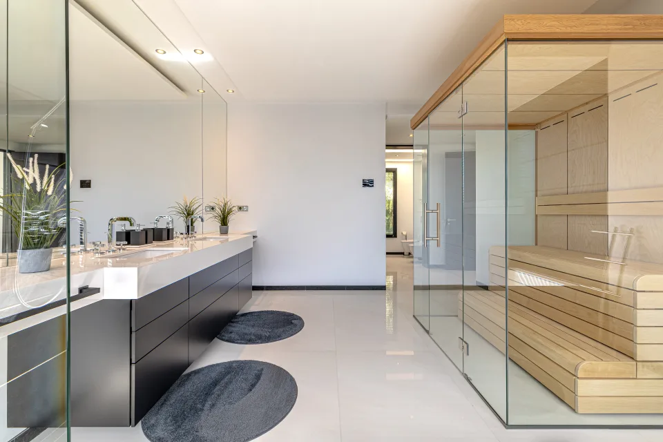 Interior design and architecture photograph of a modern bathroom with double sink, large mirrors in Guadalmina Baja